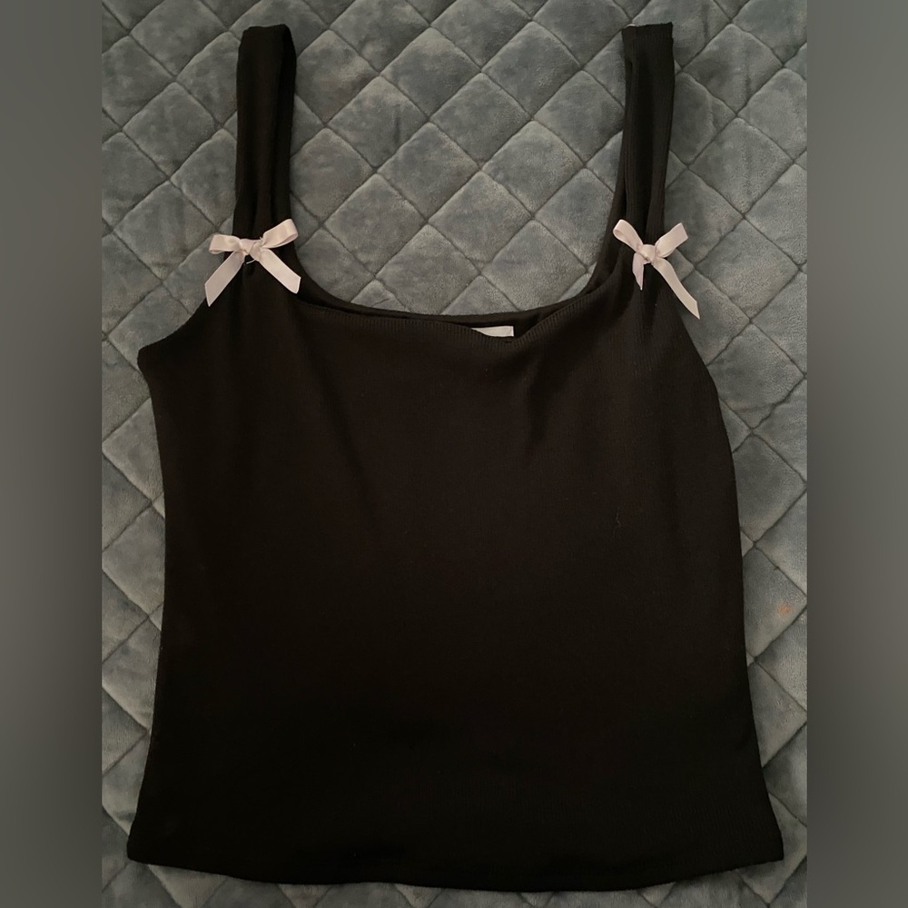 Black crop top with pink bows on shoulder